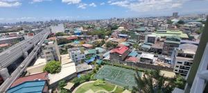 an aerial view of a city with buildings at Deluxe Studio Unit in QC for Staycation in Manila