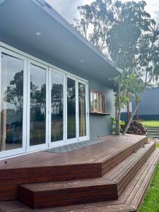 a wooden deck in front of a house at Gold Coast Retreat in Ormeau