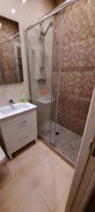 a bathroom with a shower and a sink at FRONTIMAR in Calpe