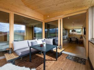 a living room with a couch and a table at Two Summits in Prama