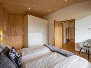 a bedroom with a bed and a chair at Two Summits in Prama