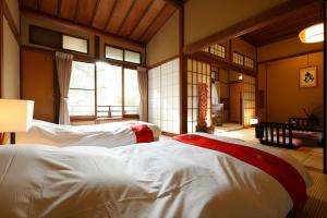 Letto o letti in una camera di Yukairo Kikuya