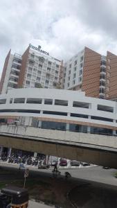 a large white building with a sign on top of it at Trivandrum in Chacka +3 photos