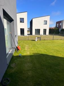a yard with a soccer ball on the grass at Apartment over two floors in Kaunas