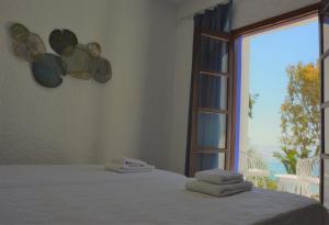 Postel nebo postele na pokoji v ubytování Poseidon Blue Gastronomy Hotel