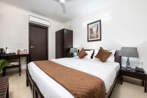 Postel nebo postele na pokoji v ubytování Palm Stay - Studios & Rooms