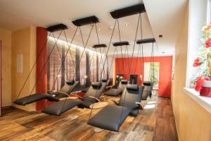 a group of chairs in a waiting room at Hotel Lohningerhof in Maria Alm am Steinernen Meer