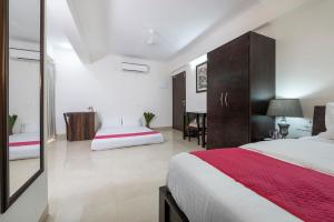 Postel nebo postele na pokoji v ubytování Palm Stay - Studios & Rooms