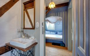 a bathroom with a sink and a mirror at Statek Polzov in Polžov