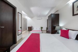 Postel nebo postele na pokoji v ubytování Palm Stay - Studios & Rooms