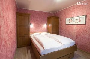 Postel nebo postele na pokoji v ubytování Appart Hotel Au Pied de Vigne