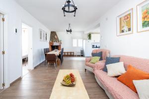 a living room with a couch and a table at Cortijo Ginatar in Dúrcal