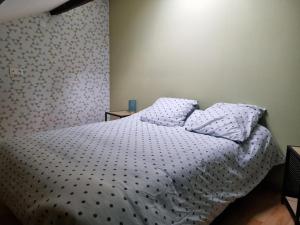Łóżko lub łóżka w pokoju w obiekcie Maison la vague