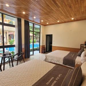 Giường trong phòng chung tại Tam Coc Mountain Lake Homestay