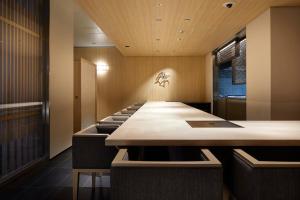 a conference room with a long table and chairs at Agora Kyoto Karasuma in Kyoto