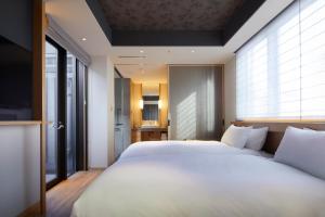 Cama ou camas em um quarto em Agora Tokyo Ginza