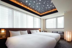 Cama ou camas em um quarto em Agora Tokyo Ginza