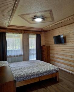 Postel nebo postele na pokoji v ubytování Voyage Tatariv