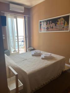 A bed or beds in a room at Villa Castello only room