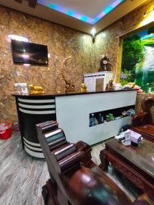 a bar with a chair and a table in a room at Nhật Phong 2 Bình Châu Hotel in Bà Rịa