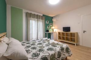 Postel nebo postele na pokoji v ubytování Una Terrazza nel Sole a Trapani