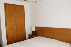 Postel nebo postele na pokoji v ubytování Apartment Gandia Playa Venecia