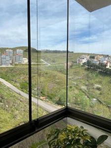 a window in a building with a view of a road at Yeni Dairede Manzaralı Lüks Mobilyalı Ferah Daire in Sinop