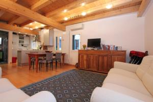 a living room with a couch and a dining room at City Apartments Biennale in Venice