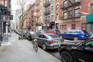 a bunch of cars parked on a city street at Smart SoHo Studio nr the subway NYC-477 in New York