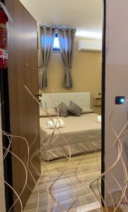 Posteľ alebo postele v izbe v ubytovaní Emyteo Apartment