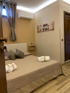Posteľ alebo postele v izbe v ubytovaní Emyteo Apartment