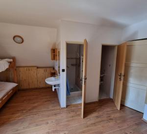 a bathroom with a sink and a shower and a mirror at Chata Horáreň in Smižany +84 photos