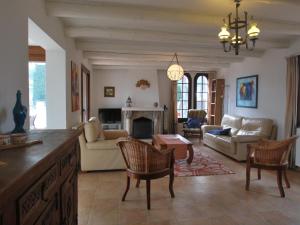 a living room filled with furniture and a fireplace at Dalí in Begur