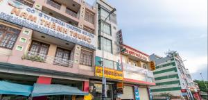 a group of buildings on a city street at OYO 265 An Thinh Loc in Danang