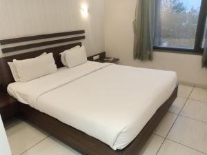 Postel nebo postele na pokoji v ubytování Hotel Kanan