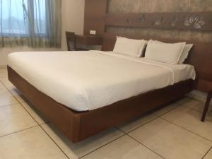 Postel nebo postele na pokoji v ubytování Hotel Kanan