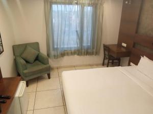 Postel nebo postele na pokoji v ubytování Hotel Kanan