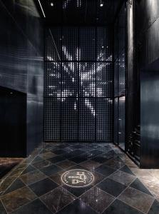 a room with a black floor with a sign on it at Baccarat Hotel and Residences New York in New York