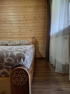 En eller flere senge i et værelse på Voyage Tatariv