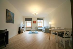 a living room with a couch and a table at Old town 2 bedroom / Top location in Rīga