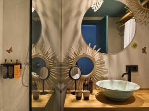 a bathroom with a bowl sink and two mirrors at Bikini Island & Mountain Port de Soller "Adults only" in Port de Soller +37 photos