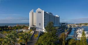 a large white building with a marina and a harbor at Tivoli Marina Vilamoura in Vilamoura