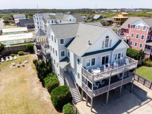 an aerial view of a house with a balcony at Silver Lining in Kill Devil Hills