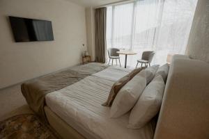 Кровать или кровати в номере Marine Residence Sea View