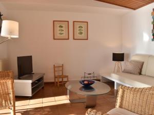 a living room with a couch and a table at Pinetells in Begur