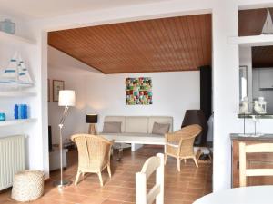 a living room with a table and chairs at Pinetells in Begur