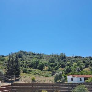 a house on the side of a hill at Potamos Private Suites in Paphos City