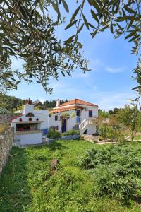 a villa with a view of the house at Villa Pefkias in Skopelos Town