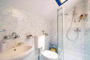 a bathroom with a toilet and a shower and a sink at Guesthouse Slavka in Dubrovnik +14 photos