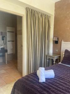 Postel nebo postele na pokoji v ubytování Hôtel de La Fossette